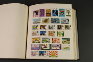 An album of various mint and used world stamps including Penrhyn Island, Pitcairn, Rhodesian Island, Ross Dependency, Sarawak, Sierra Leone, Singapore, etc   