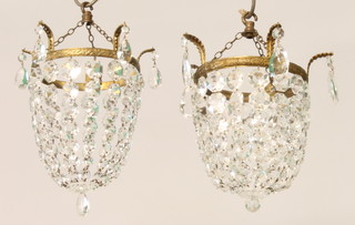 A pair of circular gilt metal and cut glass bag shaped light fittings 9" 