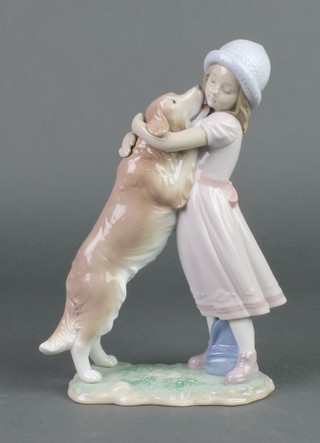 A Lladro group of a large dog licking a child 6903 10" 