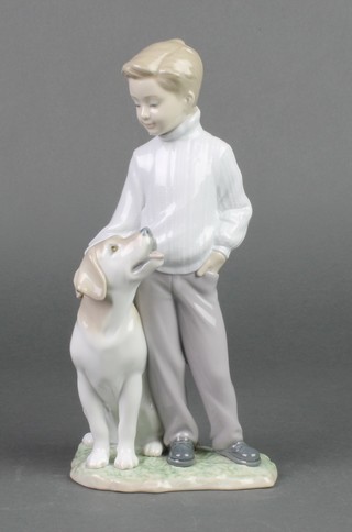 A Lladro group of a young boy with dog 3902 10" 