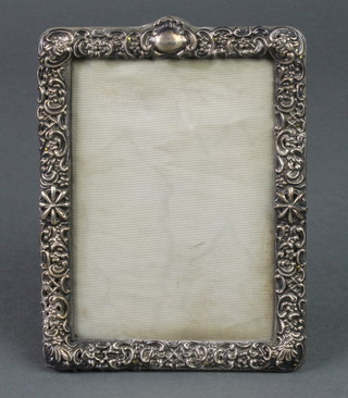 A Victorian repousse silver photograph frame 6" x 4 3/4", Birmingham 1899