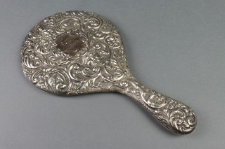 A repousse silver backed hand mirror, Chester 1911