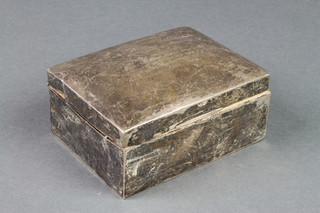 A rectangular silver cigarette box 
