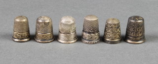 Four silver thimbles and 2 others 