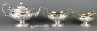 A good Georgian silver 3 piece repousse tea set with floral and scroll decoration and engraved cartouche Edinburgh 1821, 1750 grams 