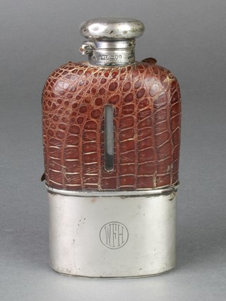 A silver and leather hip flask with silver cup base, London 1913