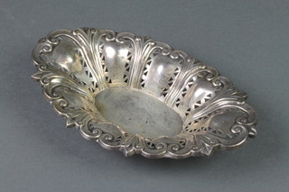 A repousse and pierced silver oval bon bon dish, 78 grams, rubbed marks