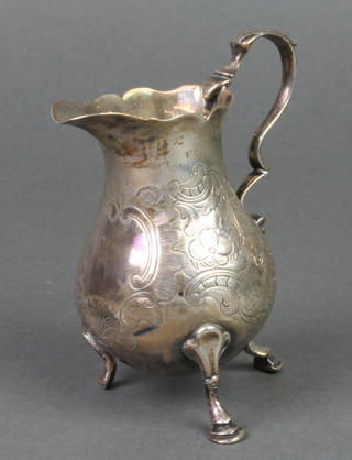 A silver pear shaped cream jug with S scroll handled on pad feet, London 1837
