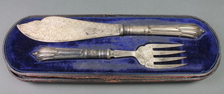 A pair of Victorian chased silver fish eaters, Sheffield 1889, cased 