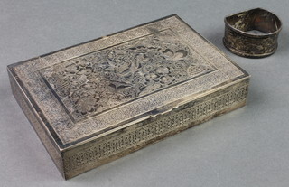 A Persian chased silver cigarette box and a napkin ring, 340 grams