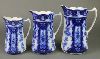 A set of 3 Edwardian blue and white transfer print graduated jugs 