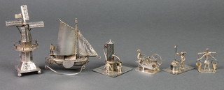 6 Continental silver models, a sailing boat, a windmill, fountain, man with barrow, water carrier and blacksmith