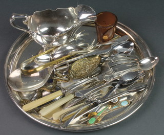 A silver plated sauce boat with cut rim, a plated salver and minor cutlery
