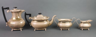 A silver plated 4 piece tea and coffee set on paw feet