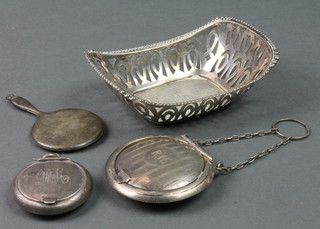 A boat shaped pierced silver bon bon dish, 54 grams, a miniature mirror, compact and plated compact