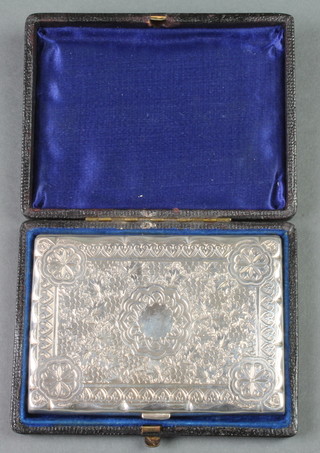 A Victorian silver card case with chased floral decoration, Birmingham 1883, 100 grams, in a fitted case 