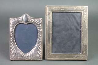 2 modern repousse silver photograph frames 7 1/2" x 5" and 8 1/2" x 7" 
