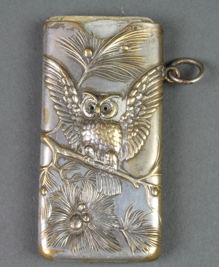A Continental silver plated repousse note holder decorated with an owl amongst branches 