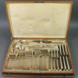 An oak canteen containing an Austro Hungarian silver service of cutlery for 6 comprising 6 tea spoons, 6 dessert spoons, 6 dessert forks, 6 dinner forks, 6 large spoons, a ladle, serving spoon, carving fork, 6 small knives, 6 large knives, a carving knife, 2 table salts and minor cutlery, 1050 grams