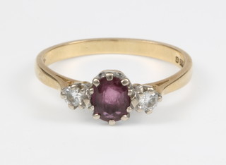 An 18ct yellow gold ruby and diamond 3 stone ring, size O 1/2