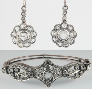An early 20th Century Indian gold and silver mounted open diamond set bangle and earrings, set with mine cut stones 
