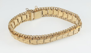 A pair of 22ct gold earrings, 8 grams, a gilt bracelet 