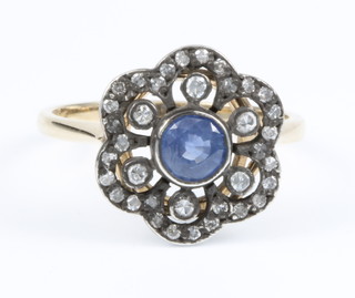 A 15ct yellow gold sapphire and diamond open ring, size M 1/2