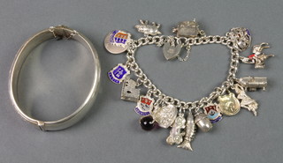 A silver charm bracelet and a ditto hollow bangle, 82 grams
