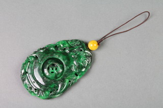 A 20th Century Chinese carved hardstone pendant with reticulated disc 4" 