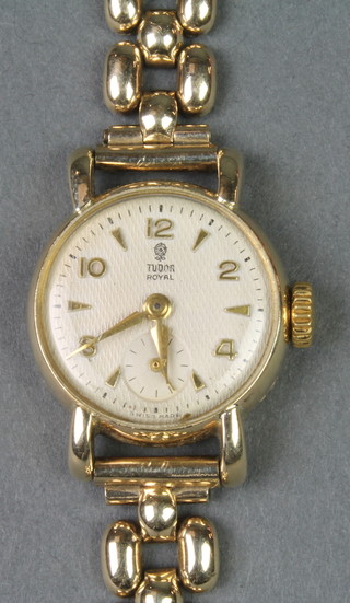 A lady's 9ct gold Tudor Royal wristwatch with seconds at 6 o'clock, on a 9ct gold bracelet, boxed 

