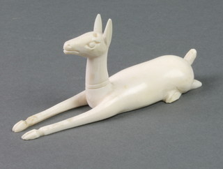 A carved ivory figure of a reclining deer 5" 