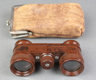 A pair of Bakelite opera glasses, cased