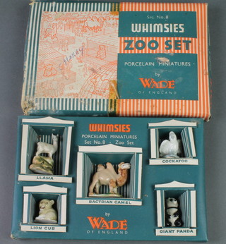 A Wade Whimsey Zoo set consisting of cockatoo, great panda, bactrian camel, lion cub and lama, boxed 