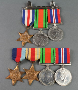 2 World War Two groups 1939-45 and Africa Star, Defence and War medal and a trio France and Germany Star, Defence and War medal 