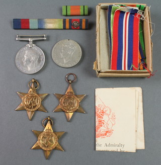 A Second World War group 1939-45 Burma and Atlantic Star, Defence and War medal in posting box to Mr R T Merchant, 49 Sandigate Road, Brighton 6, Sussex 