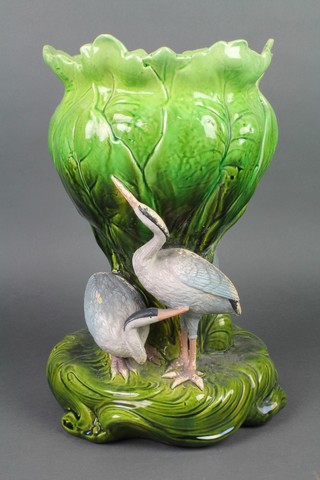 A Bretby jardiniere in the form of herons sitting and standing beneath a flower, 15" 