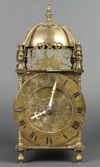 A striking lantern clock with 5" brass dial and Roman numerals contained in a gilt case 