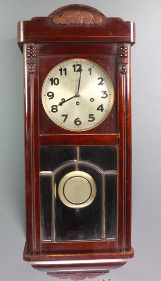 A chiming wall clock with 8" silver dial and Arabic numerals contained in a mahogany case 