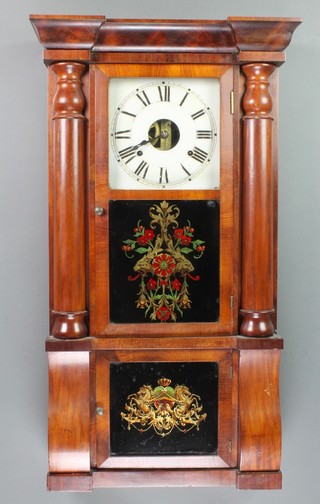 Seth Thomas, An American 8 day striking wall clock with 9" dial, the back paper marked "Eight Day Weight Clocks, Seth Thomas, Thomaston, Conn" contained in a walnut case with moulded cornice and supported by 2 columns, having a glass painted door
