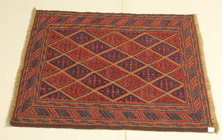 A red and blue ground Gazak rug having stylised diamonds to the centre 47" x 43" 