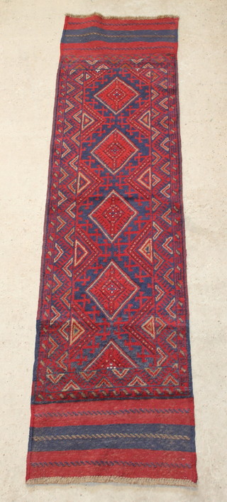 A Persian red and blue ground runner with 4 octagons to the centre 98" x 25" 