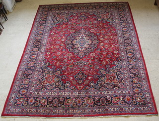 A red and blue ground Persian carpet, signed 151" x 118" 