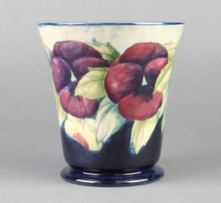 A 1920's William Moorcroft tapered vase decorated with pansies, signature mark to base 6 1/2"  