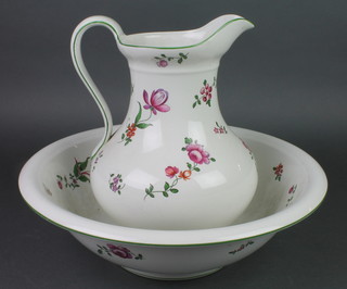 An Edwardian wash bowl and jug decorated with roses 