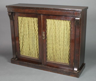 A Regency rosewood chiffonier fitted a cupboard enclosed by grilled panelled metal doors and having columns to the side 35 1/2"h x 43 1/2"l x 13"d 