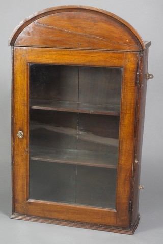 An 18th Century oak hanging cabinet with arch shaped top, fitted shelves enclosed by glazed panelled door 42"h x 25"w x 9"d 