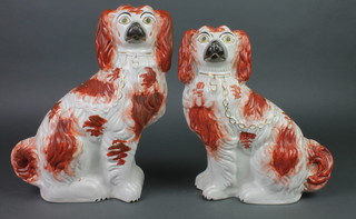 A pair of Victorian Staffordshire ochre and gilt decorated Spaniels 12" 
