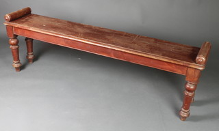 A 19th Century rectangular mahogany hall bench raised on turned supports with scroll arms 19"h x 59"w x 12"d 
