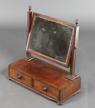 A 19th Century rectangular plate dressing table mirror contained in a mahogany swing frame, raised on a rectangular base fitted 2 drawers with tore handles 21"h x 19 1/2"w x 20"d 