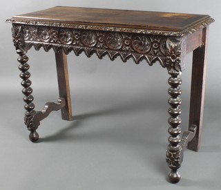 A Victorian rectangular carved and ebonised hall table with carved apron, raised on bobbin turned supports 29"h x 41"w x 17"d 